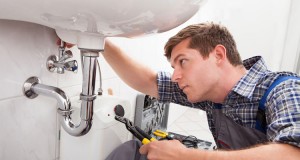 Handyman replacing a faucet.